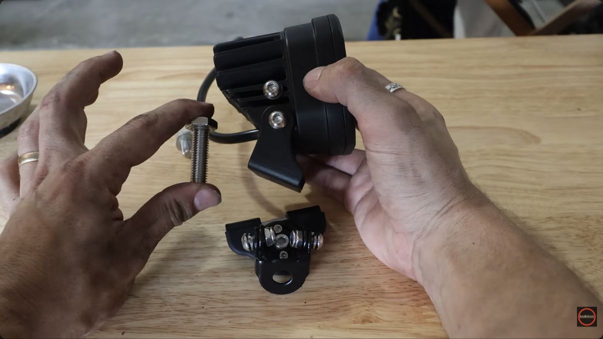 Mounting hardware shown during the Auxbeam light installation